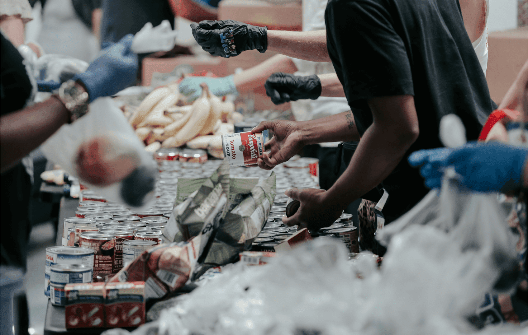 People donating food at a not for profit or charity organisation